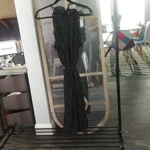 Polka dot dress with ruffles around the arm holes.